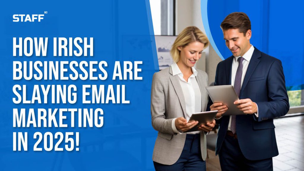 Two professionals in business attire discussing email marketing strategies with digital devices in an office setting, representing how Irish businesses are excelling in email marketing in 2025.
